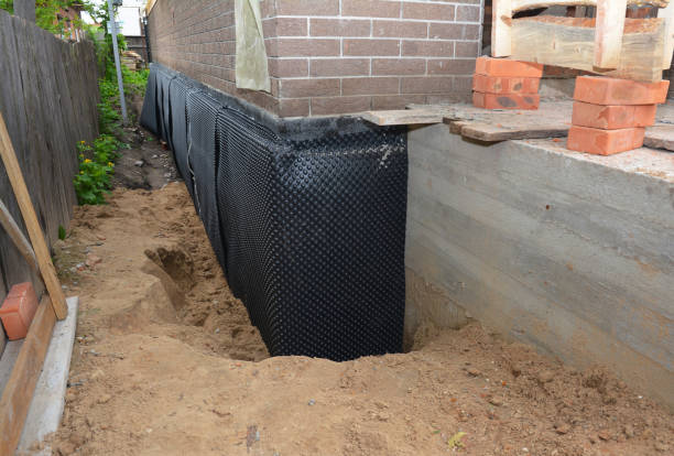 Happy homeowners after waterproofing job in Mount Freedom